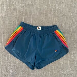 Aviator Nation Women’s 5 Stripe Flex Board Shorts, Navy/Rainbow